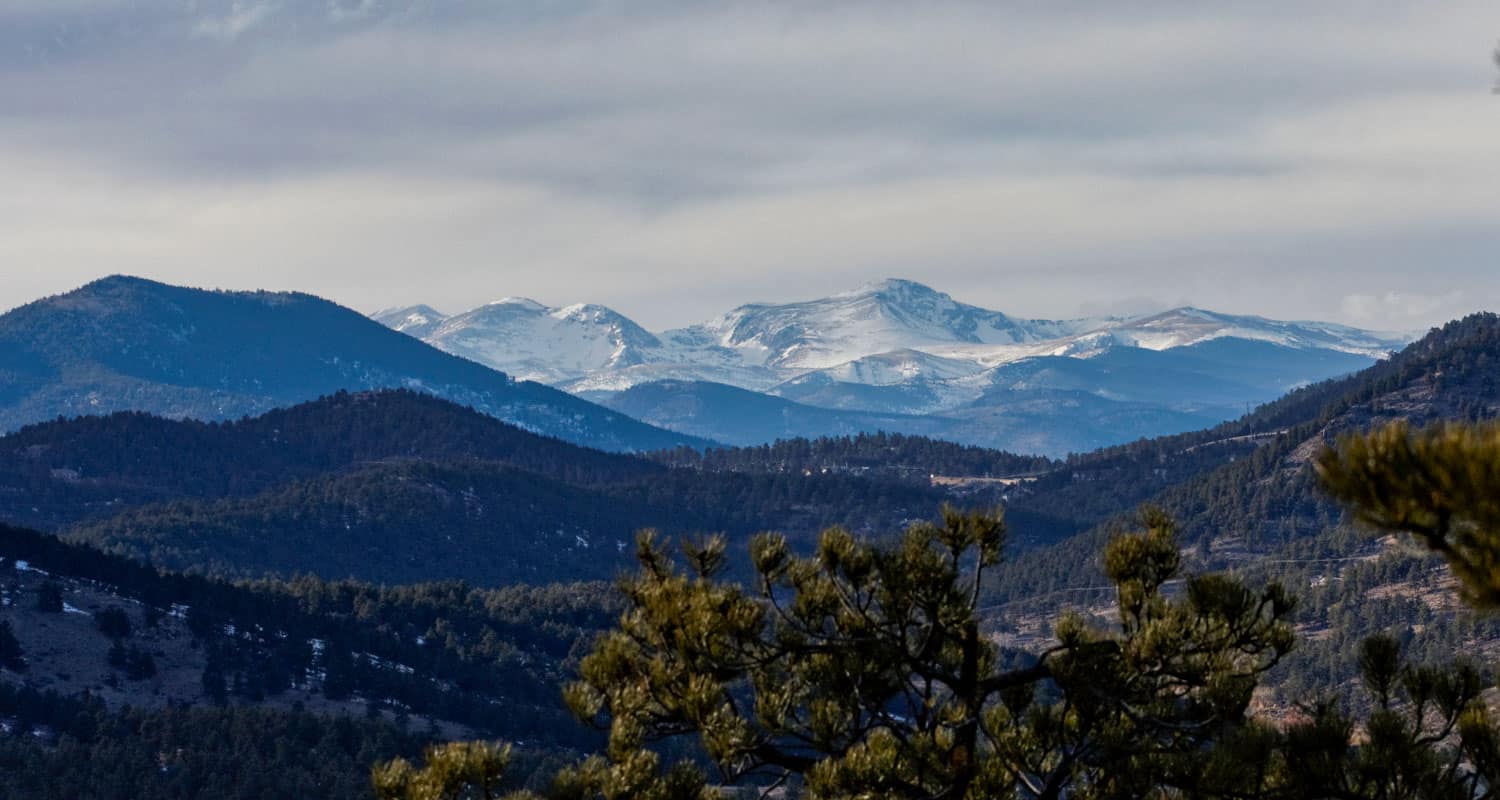 view to the western rocky mountain from panorama point in corwina park hike near denver