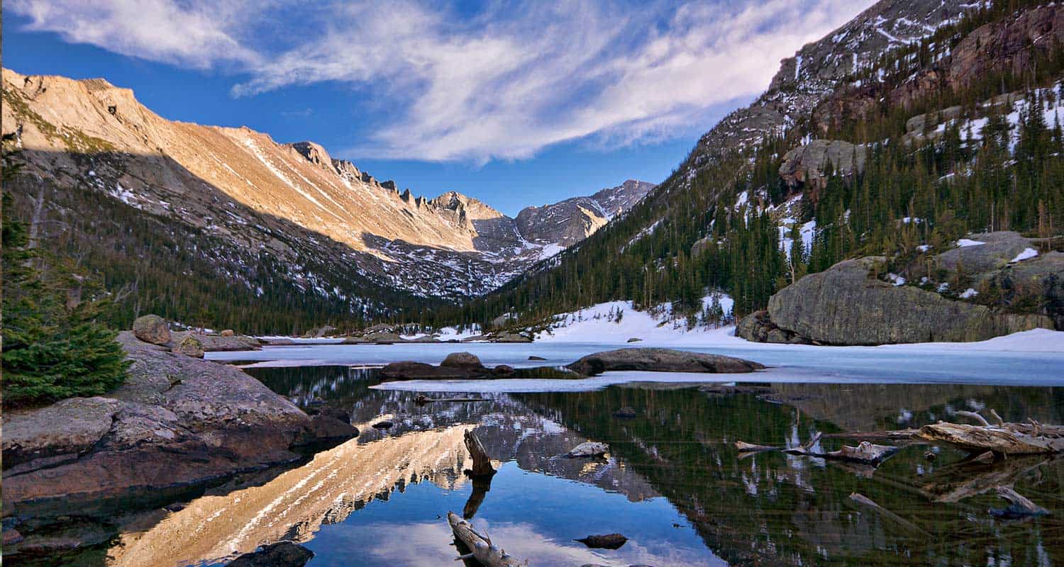 reflection of keyboard of the winds in mills lake in rocky mountain national park