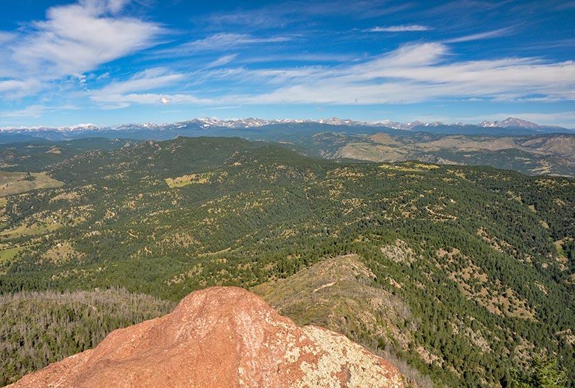 view out to front range mountains near indian peaks from the summit of South boulder peak