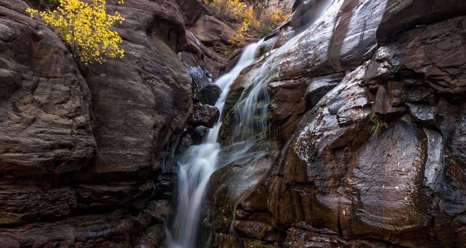 hays creek waterfall cascading over red granitic sandstone near carbondale colorado