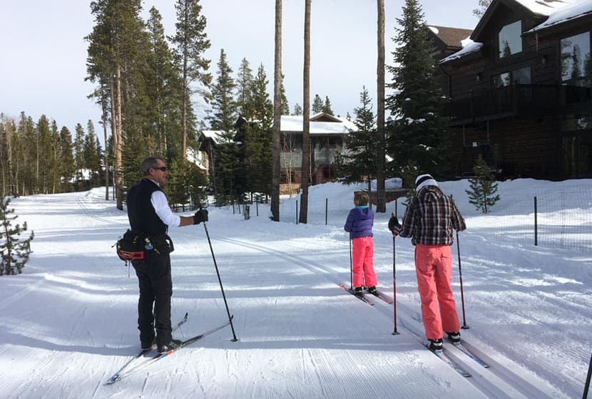 two children taking cross country ski lesson with gary at breckenridge nordic center in colorado