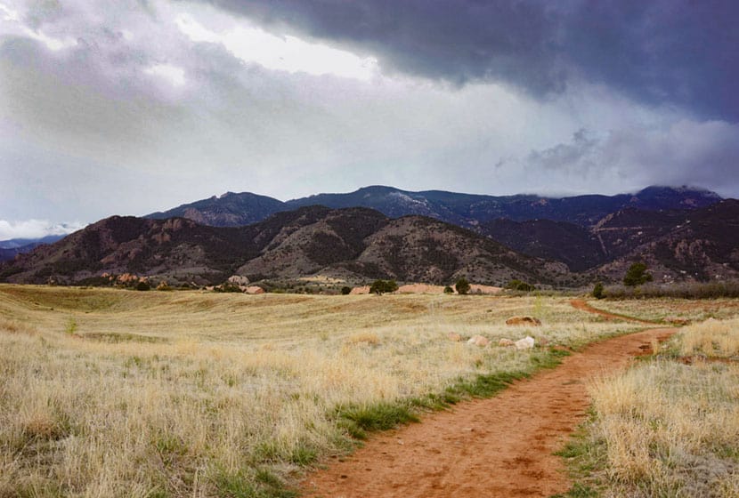 dirt trail leading toward foothills south of red rock open space on hike in colorado springs
