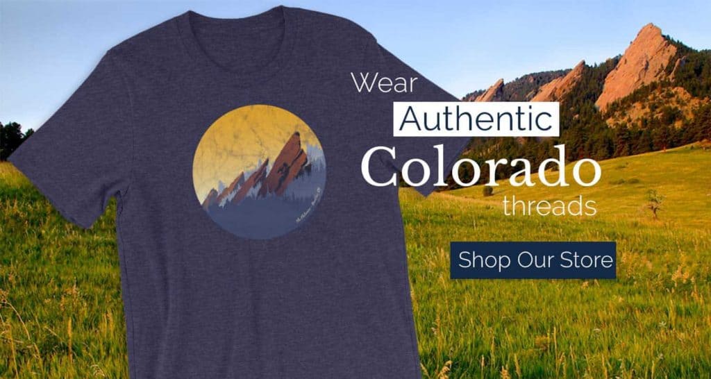 tshirt in blue midnight heather color with flatirons and words wear authentic colorado threads shop our store overlay text on image